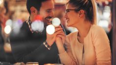 Romantic couple dating at night in pub